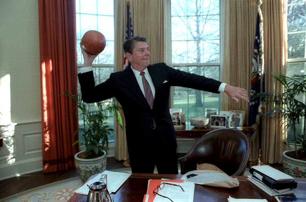 President Reagan throwing a USC football in the Oval Office. March 26, 1982.jpg