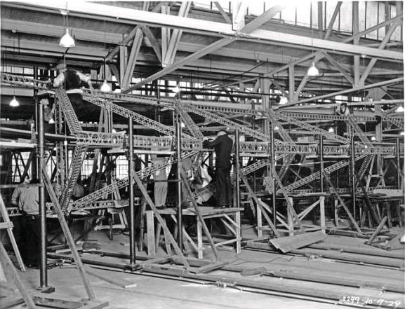 men working on the frame of the U.S.S. Akron.jpg