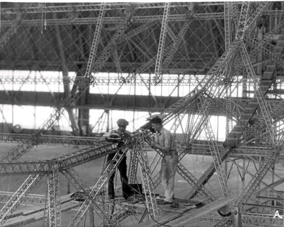 Two unidentified men working on the frame of the U.S.S. Akron.jpg