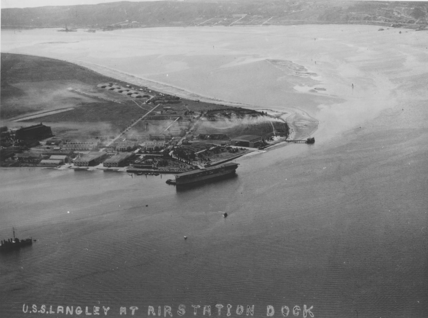 USS LANGLEY (CV 1) at the United States Naval Air Station dock, San Diego, CA, December 1924.jpg