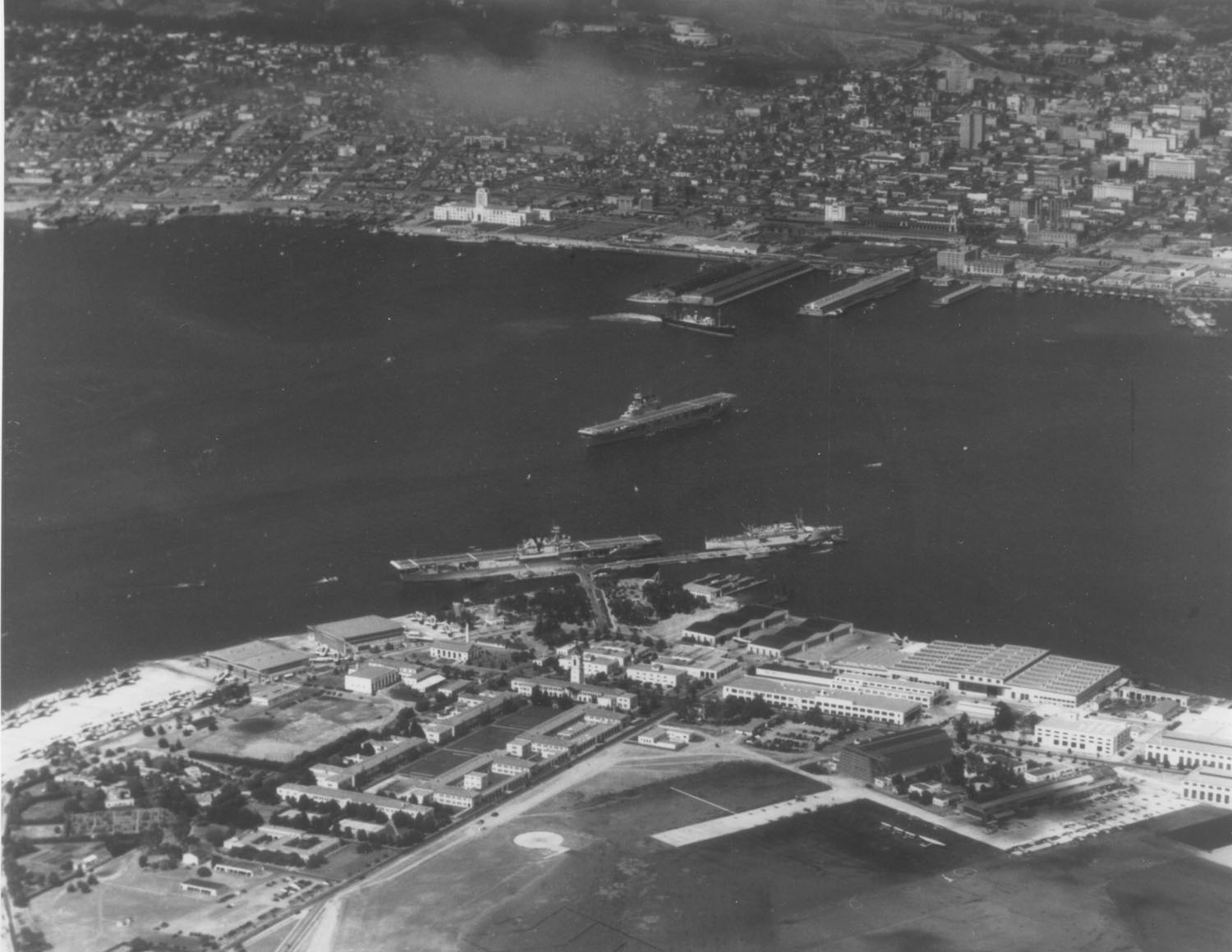 NAStation San Diego 28 June 1939. USS YORKTOWN (CV-5) and USS WRIGHT (AV-1) at the dock, USS ENTERPRISE (CV-6) in the stream. Taken from ENTERPRISE plane.jpg