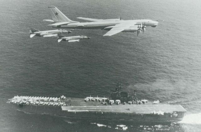 TU 95 passing over USS Kitty Hawk intercepted and escorted by the F 4s from the carrier's air wing..jpg