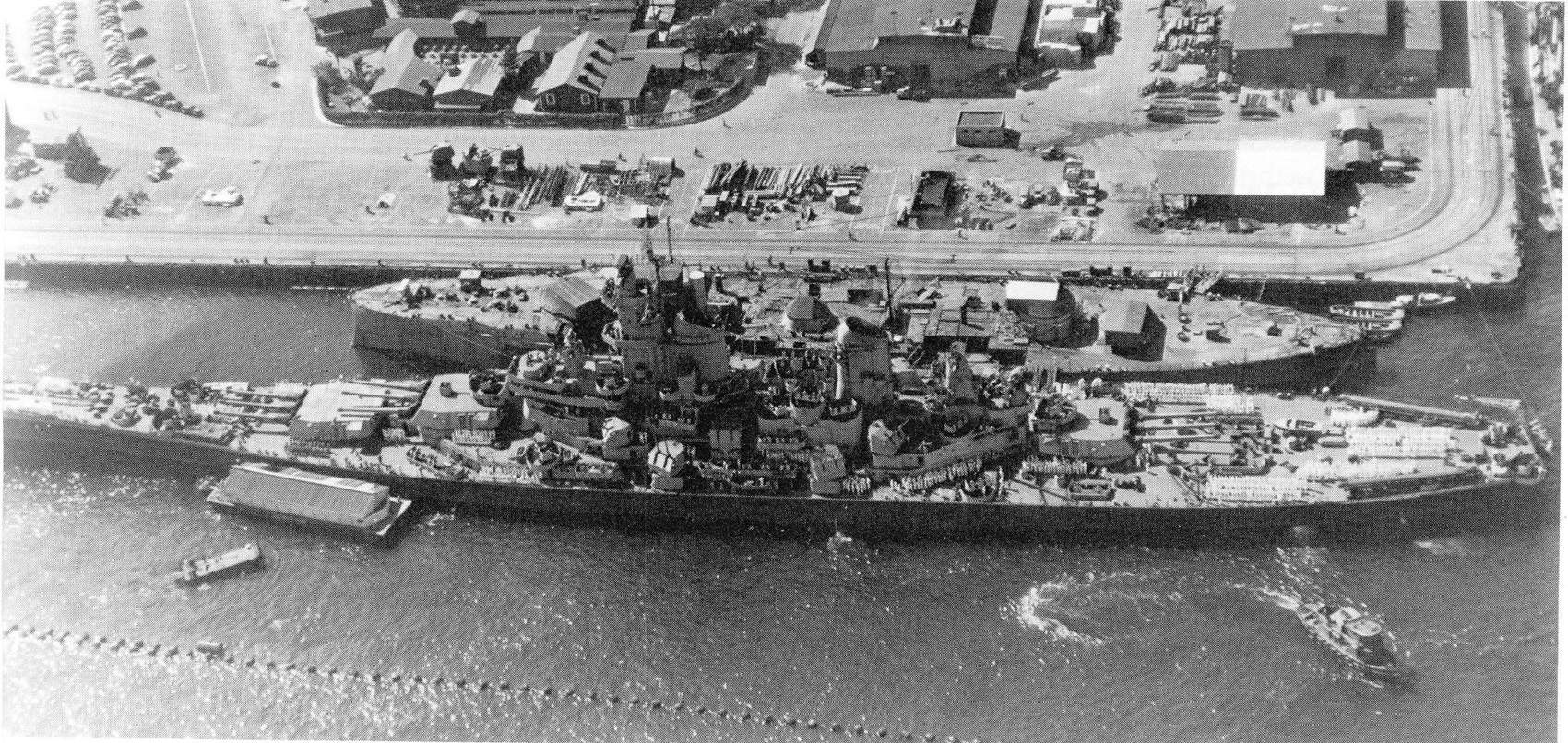USS Oklahoma and USS Wisconsin in Pearl Harbor.jpg