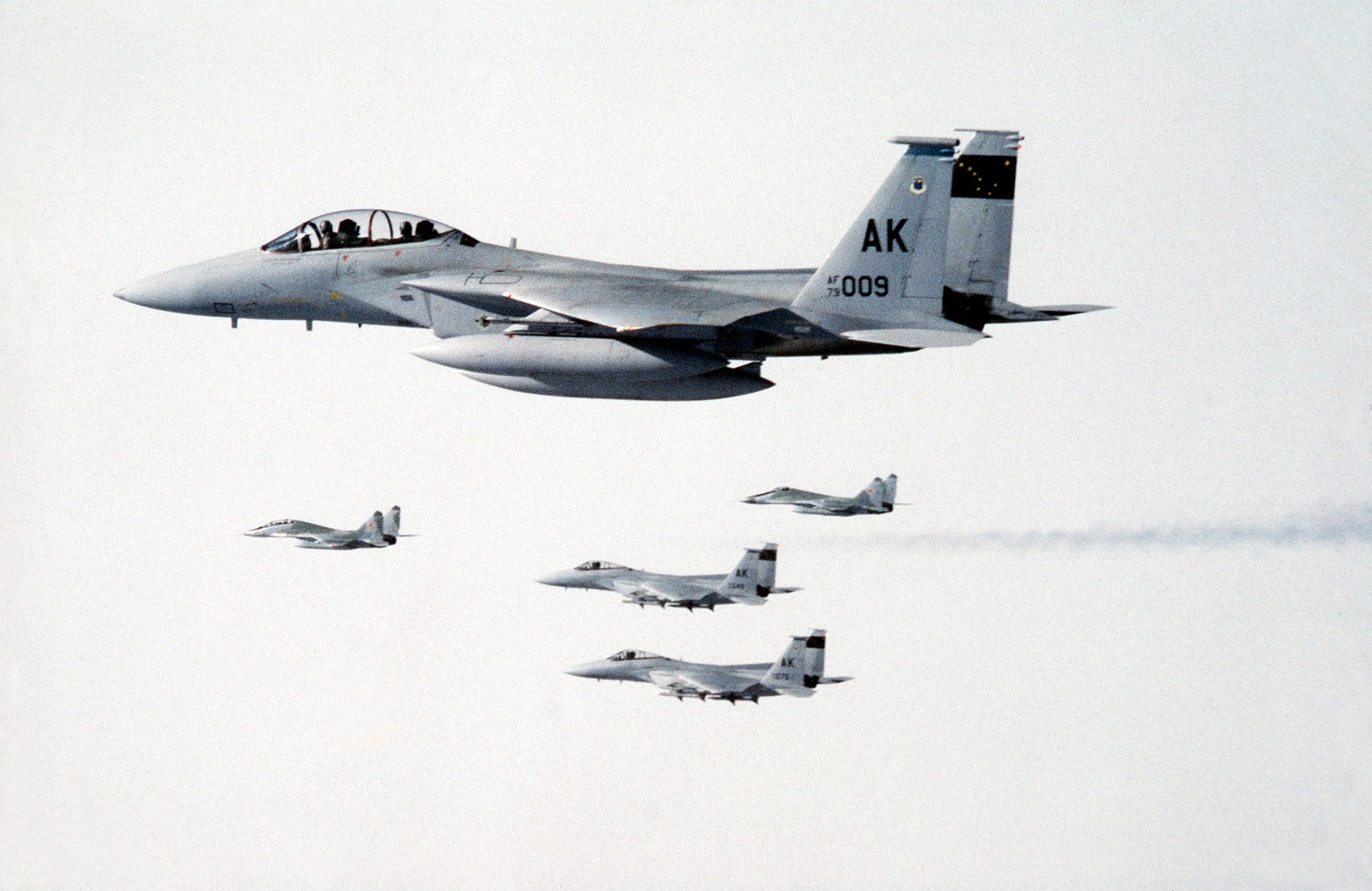 gpw-200701b-UnitedStatesAirForce-DFST9005774-USAF-F-15-Eagle-fighters-escort-two-MiG-29-fighters-to-Elmendorf-AFB-Alaska-for-refueling-medium.jpg